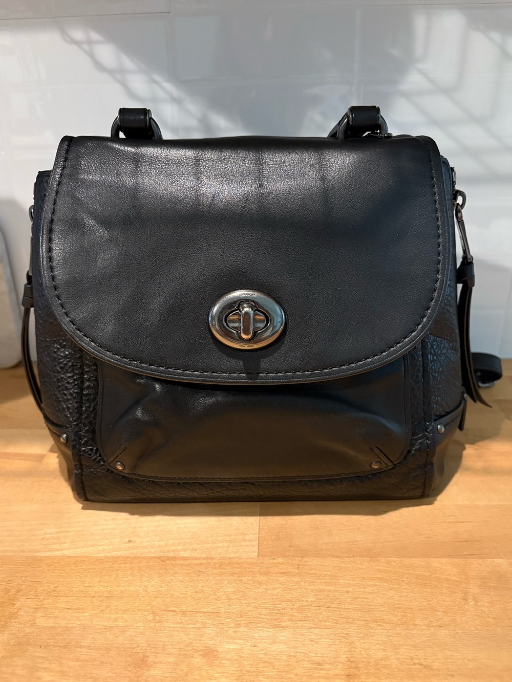 Coach Black Leather Turnlock Flap Crossbody Backpack